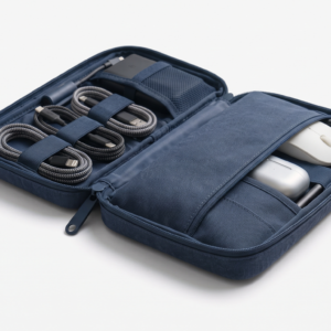 Navy Blue multi-compartment travel tech organizer bag open to display internal mesh pockets and elastic loops